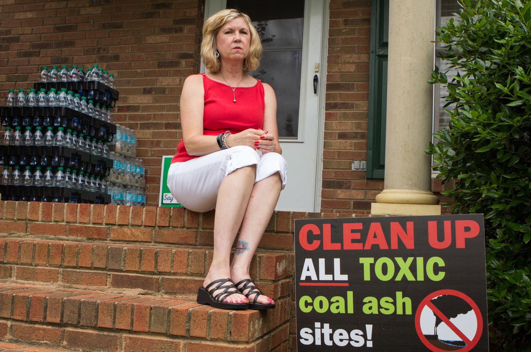 Debbie Baker sits in front of her Belmont, N.C., home. She has been an outspoken advocate against coal ash since contaminants were found in her water since 2015. (Jasmine Spearing-Bowen/News21)