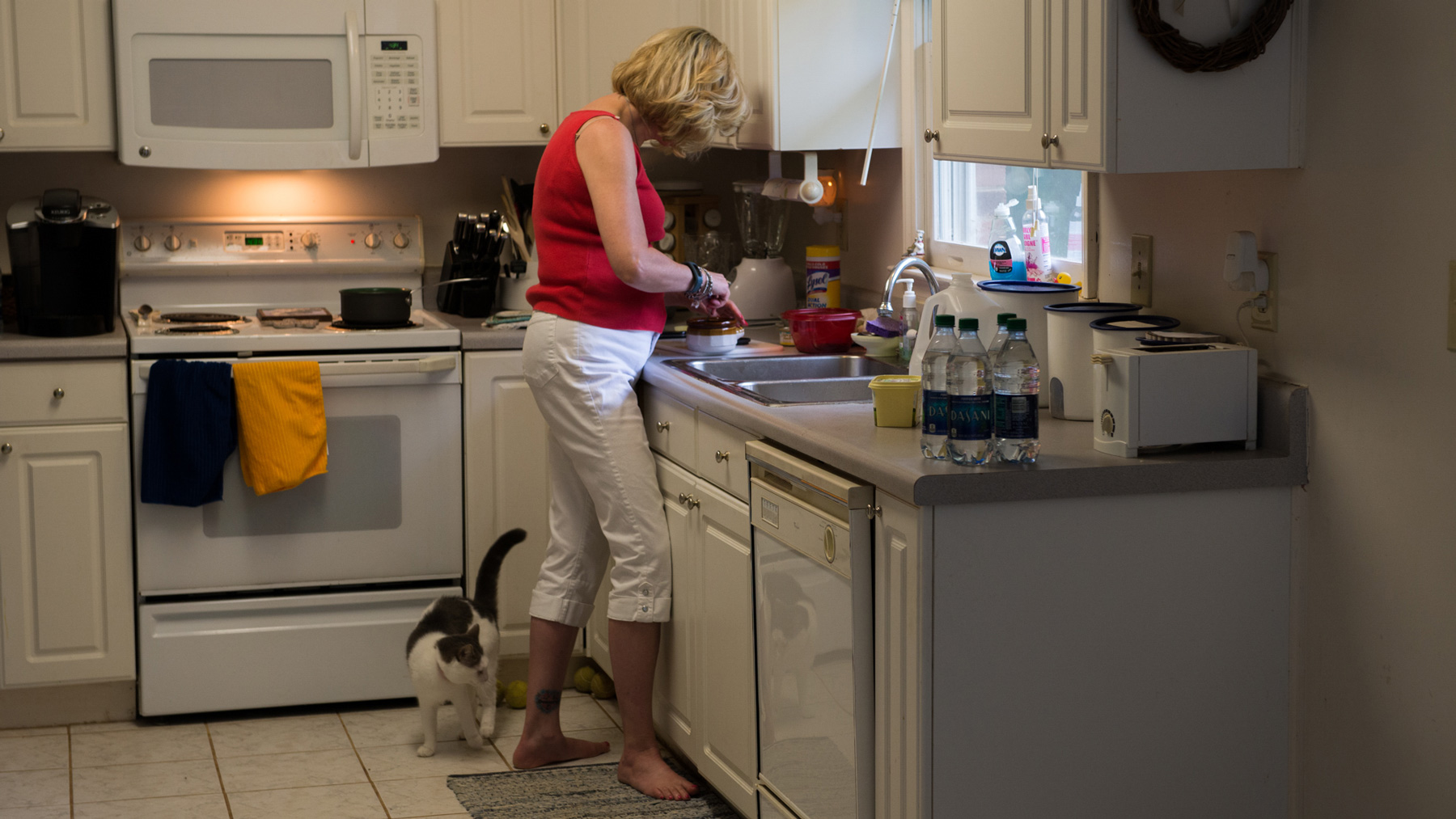 Debbie Baker prepares food in the kitchen of her Belmont, N.C., home. She uses bottled water to drink and cook with. (Chelsea Rae Ybanez/News21)