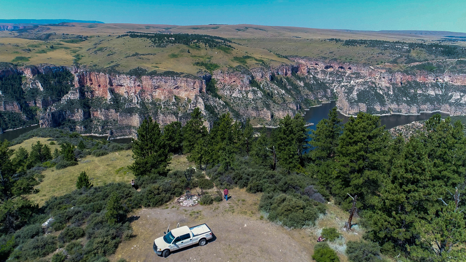 John Doyle collects sage at Pretty Eagle Point, a section of Big Horn Canyon in Montana, a sacred site and burial ground for the Apsaalooke Nation. (Claire Caulfield/News21)